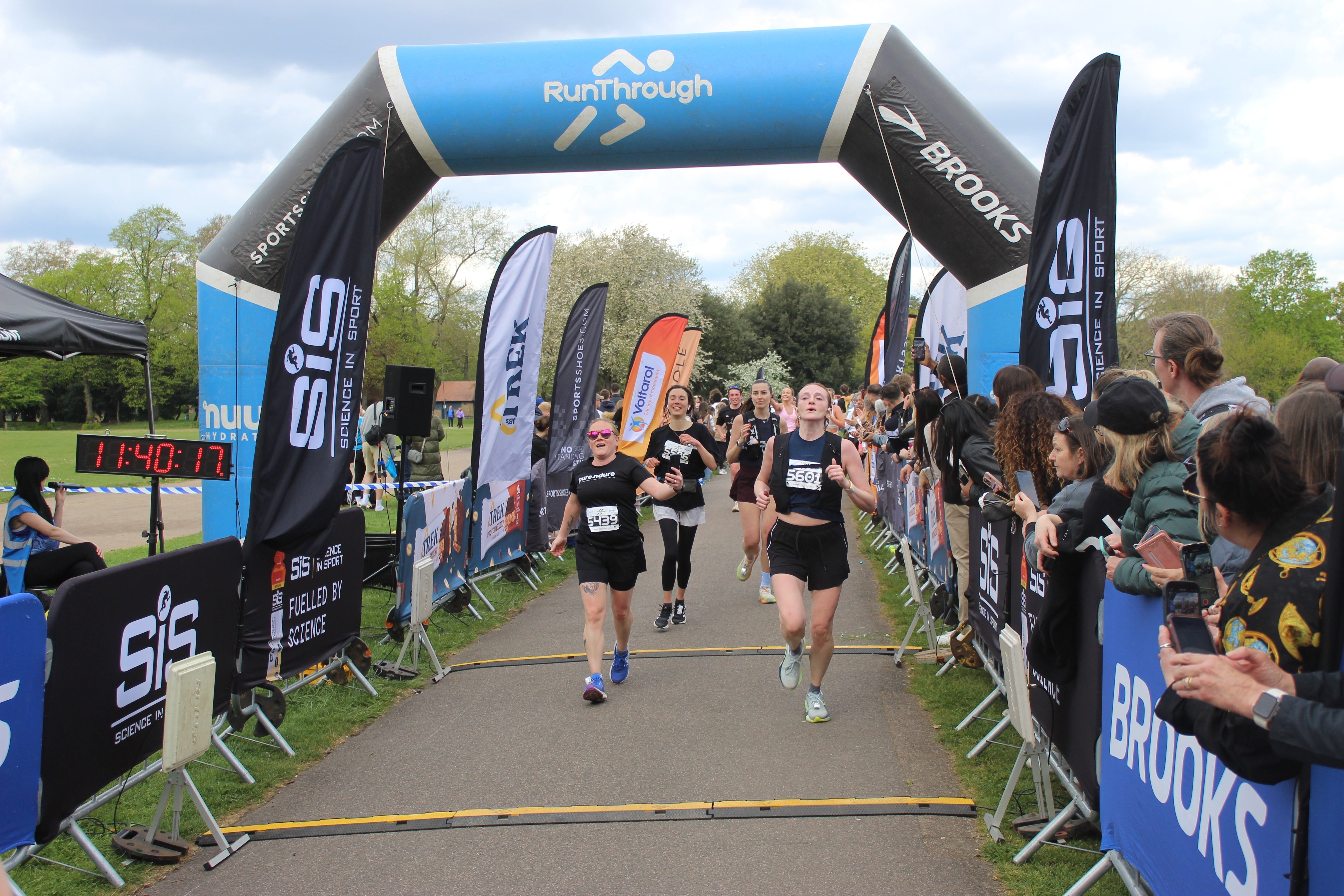 Our Co-founder Hayley crossing the finsih line of her first half marathon fuelled by Purendure®