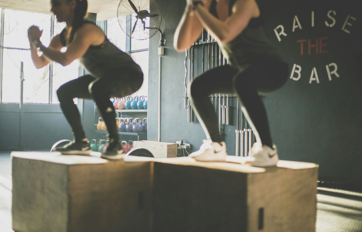 Crossfit Athlete doing box jumps when properly fuelled